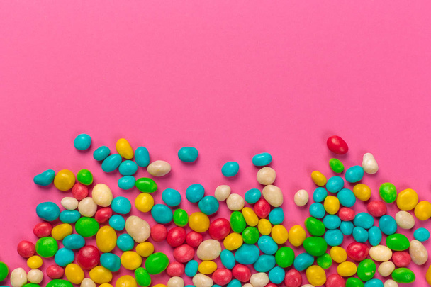 Colorful lollipops on a pink background - Zdjęcie, obraz