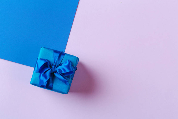 close up of gift box on color background - Фото, изображение