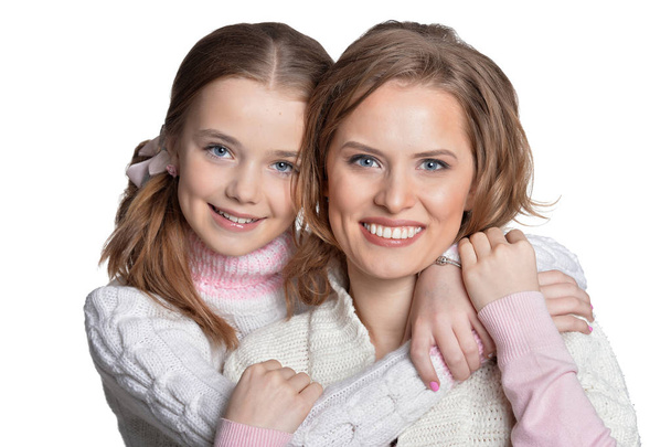 Portrait of happy mother and daughter isolated on white background  - Фото, изображение