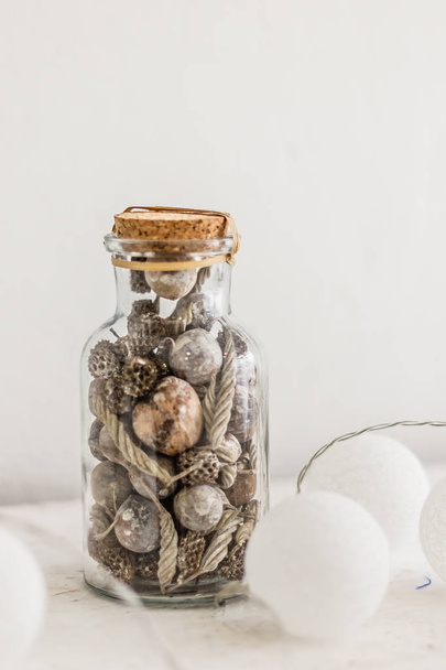 glass jar with cones, Christmas decoration on white background - Fotoğraf, Görsel