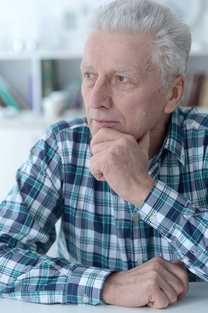 Close up portrait of thoughtful senior man at home - Photo, Image