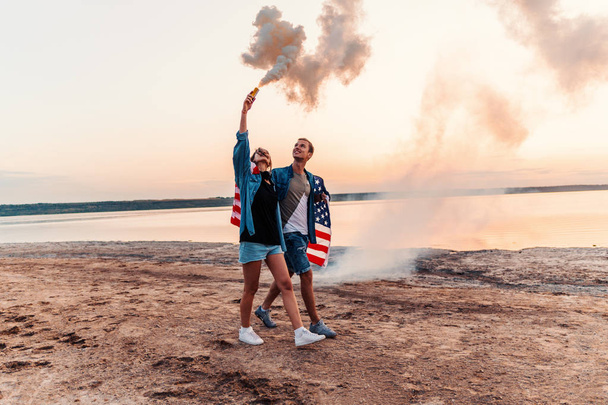 american couple with hand flare or fusee - Foto, afbeelding