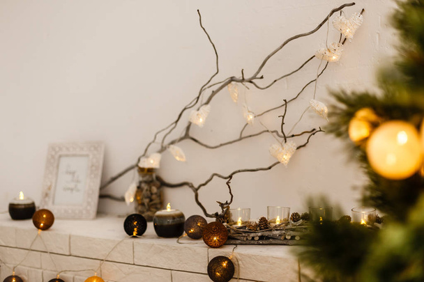  garland on dried wooden branch close up, decor concept - Foto, imagen