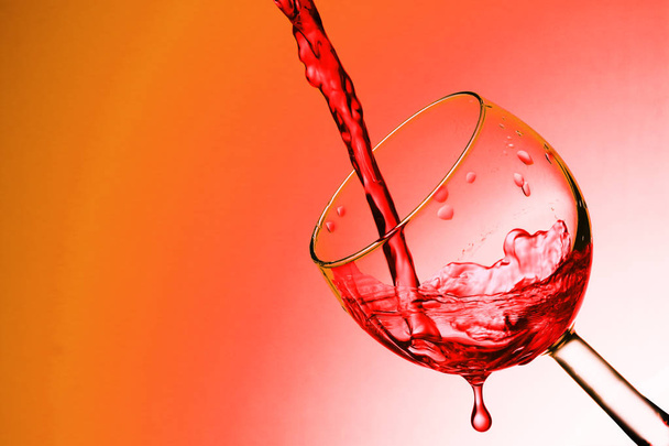 pouring wine on a blue background - Photo, Image