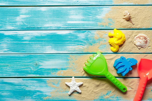 Children toys on wooden deck on wooden background - Photo, image
