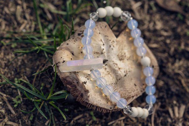 Natural mineral beads bracelet on natural background - Photo, Image