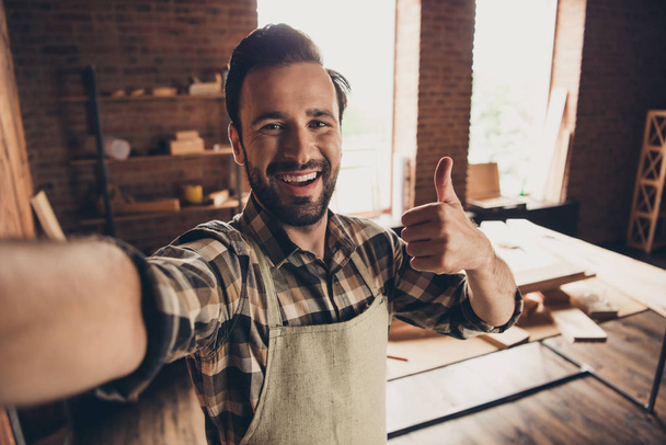 Good day mood build builder construction constructor engineer workman repairman concept. Close up photo portrait of cheerful glad handsome beaming toothy bearded guy make take selfie on smart phone - Photo, image