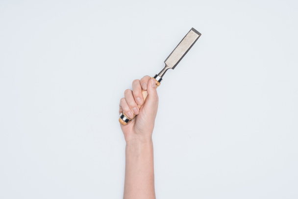 cropped shot of woman holding chisel isolated on white - Foto, Imagem