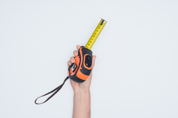 cropped shot of woman holding measuring tape tool isolated on white - Fotografie, Obrázek