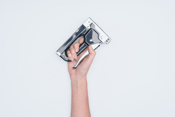 cropped shot of woman holding stapler isolated on white - Photo, Image