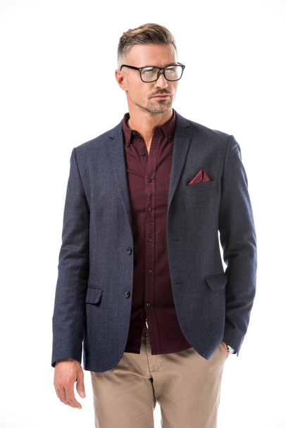 confident stylish man in eyeglasses and jacket looking away isolated on white - Photo, Image