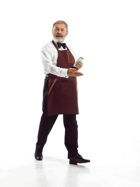 Senior waiter at studio - Фото, изображение