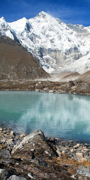 view of mount Cho Oyu mirroring in lake - Cho Oyu base camp - Everest trek - Nepal Himalayas mountains - Valokuva, kuva