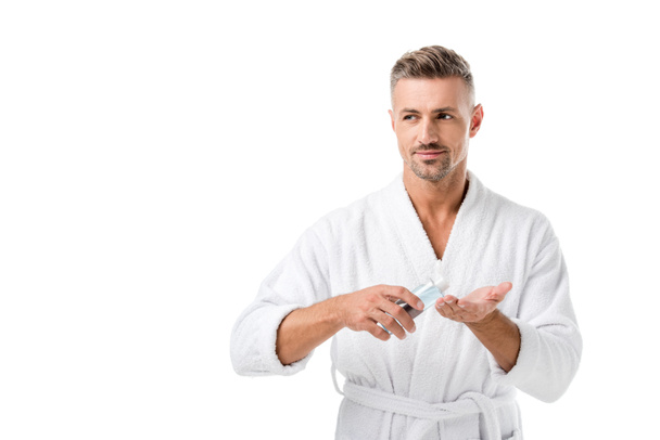 adult man in bathrobe using shaving lotion isolated on white - Φωτογραφία, εικόνα