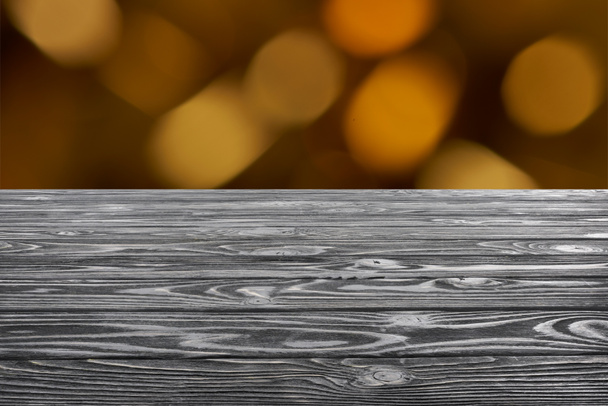 template of grey wooden floor on blurred orange background - Foto, imagen