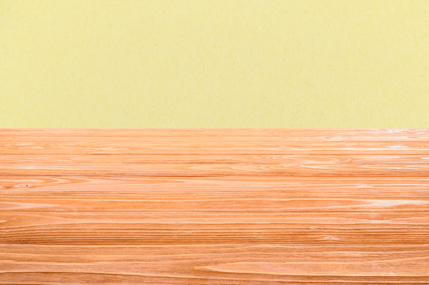 template of orange wooden floor with yellow background - Foto, Imagem