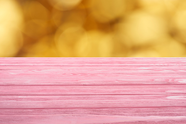 template of pink wooden floor on blurred orange background - Foto, afbeelding