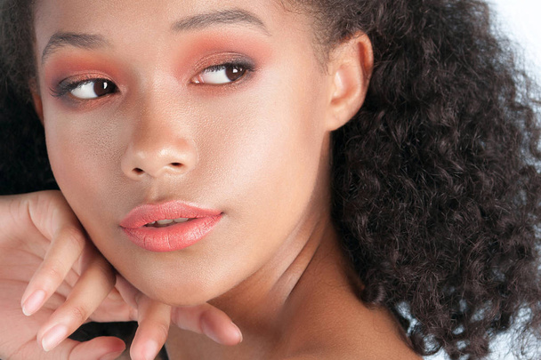 Young beautiful black girl with clean perfect skin close-up. Beauty portrait - Photo, image