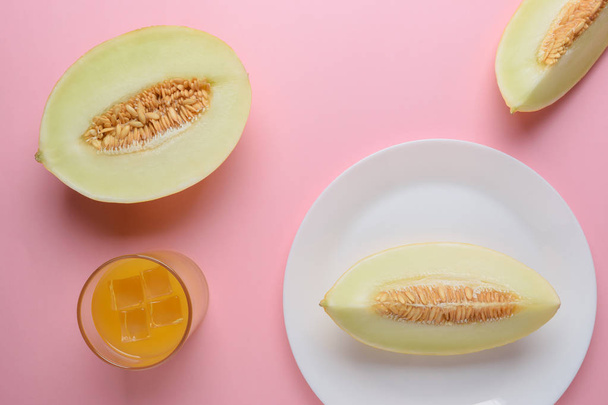 Melon sliced on pastel pink background. Minimal fruit concept. - Fotoğraf, Görsel