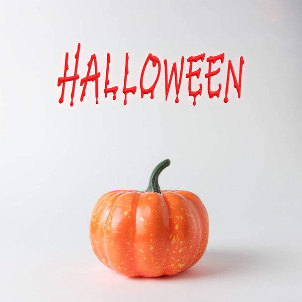 Halloween pumpkin on white background. Halloween minimal concept. - Fotoğraf, Görsel