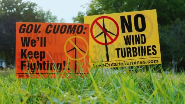 Wilson, NY, USA, September 2017: Poster with agitation against wind turbines. People are outraged by the proximity and size of wind generators - Кадры, видео
