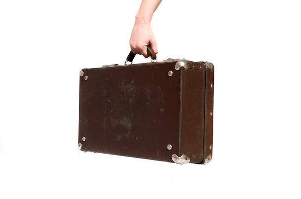 Retro suitcase and female hands isolated on the white background. - Photo, Image