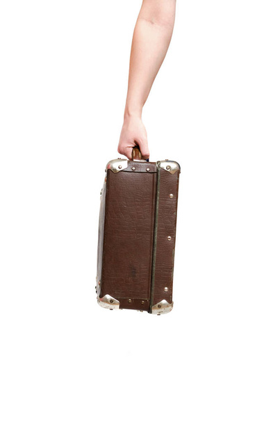 Retro suitcase and female hands isolated on the white background. - Valokuva, kuva