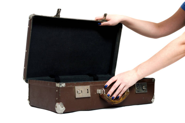 Retro suitcase and female hands isolated on the white background. - Photo, Image