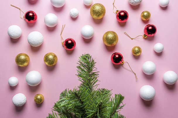 Christmas tree with decoration balls on pink background. New Year minimal concept. Flat lay. - Φωτογραφία, εικόνα
