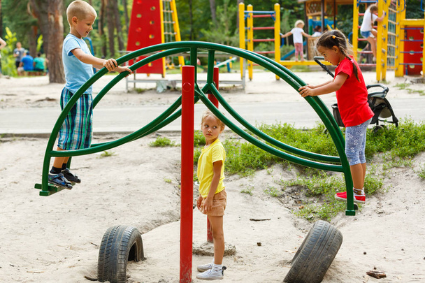 children on playground in the park - Foto, afbeelding