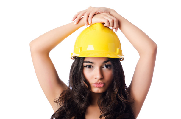 Young woman with hellow hard hat on white - Foto, immagini