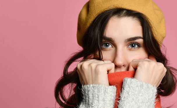 Cute woman wrapped up warm in winter clothes - Photo, image