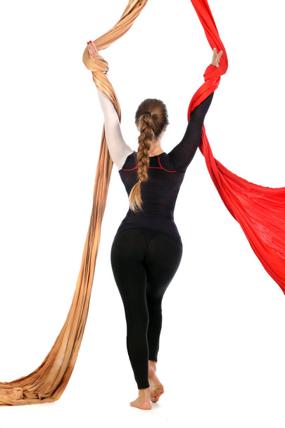 girl gymnast on aerial silk isolated on white background studio - Zdjęcie, obraz