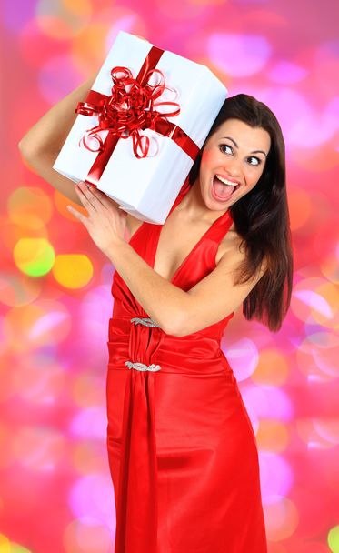 Beautiful girl with gifts. - 写真・画像