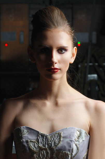 Low key portrait of beautiful model in lace fitted dress posing - Foto, immagini