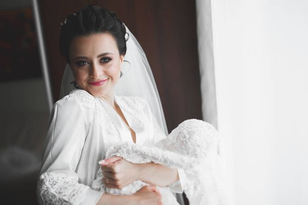 Portrait of a beautiful fashion bride, sweet and sensual. Wedding make up and hair - Фото, изображение