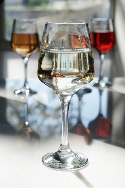 Glass of tasty wine on table - Photo, Image