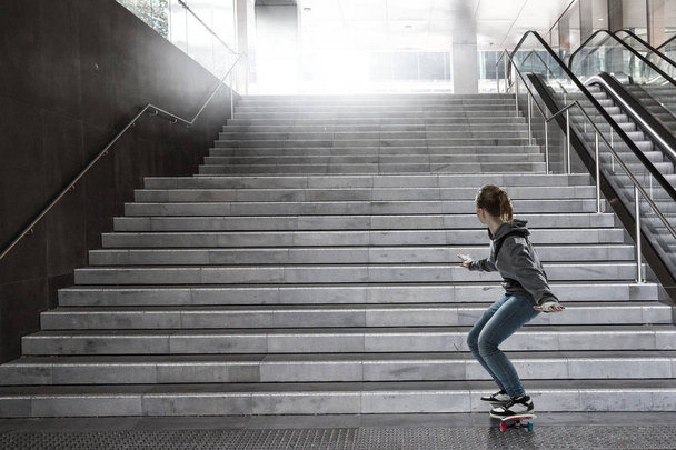Teenager girl ride her skateboard. Mixed media - Photo, Image