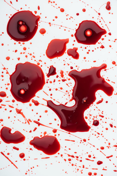 top view of messy blood splashes on white - Foto, immagini