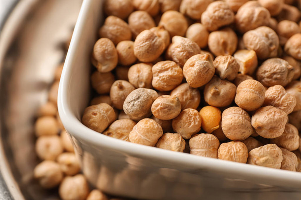Bowl with dry chickpeas, closeup - Photo, Image