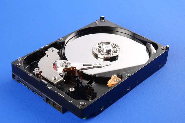 Hard disk drive (HDD) isolated on a blue background - Photo, Image
