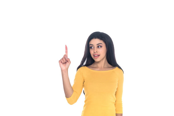 young african american woman pointing up with finger and looking away isolated on white - Photo, Image