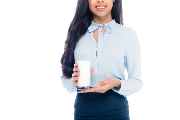 cropped shot of happy young african american woman holding glass of milk isolated on white  - Photo, Image