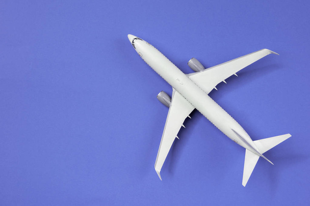 Photo of airplane isolated on empty blue background - Fotoğraf, Görsel