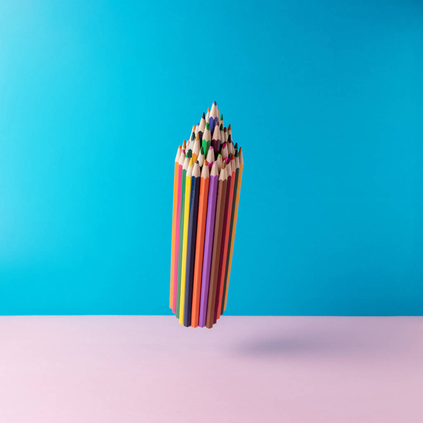 School color pencils on pastel background. Minimal concept art. - 写真・画像