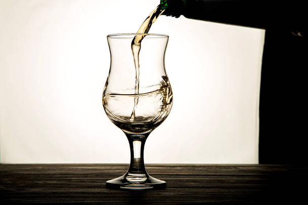 pouring a drink into a glass - Photo, Image