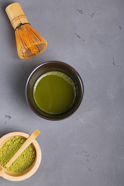 Matcha tea in a traditional bowl, whisk and powder - Фото, зображення