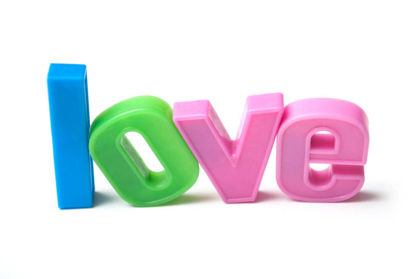 closeup of colorful plastic letters on white background - Love  - Foto, Bild