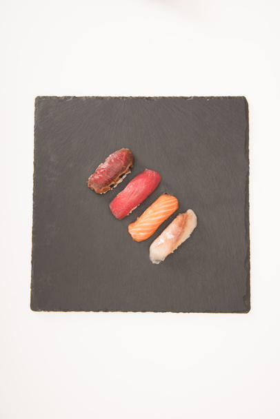 Top view of sashimi sushi on grey slate - Foto, immagini