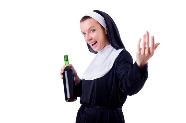 Nun with bottle of red wine - Foto, afbeelding